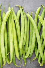 Green beans  on a gray background.