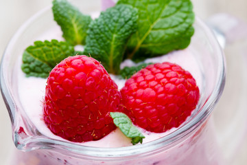 Raspberry milk shake with mint decor.