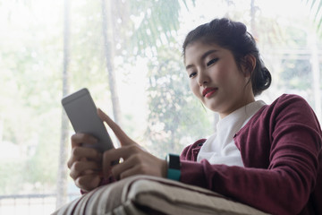 Asian woman student in lifestyle using mobile phone connection concept