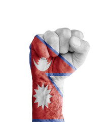 Flag of Nepal painted on human fist like victory symbol
