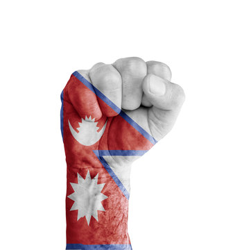 Flag of Nepal painted on human fist like victory symbol