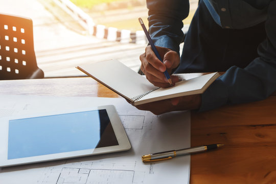 Architect take note on notebook, architectural concept