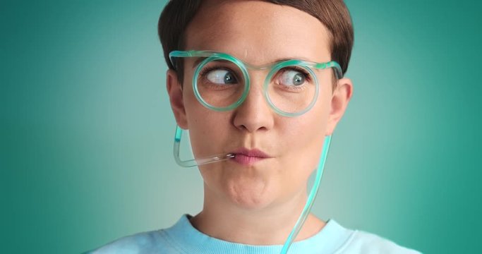 funny woman use drinking sstraw glasses