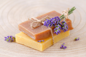 organic soap with fresh lavender flowers on wooden, closeup
