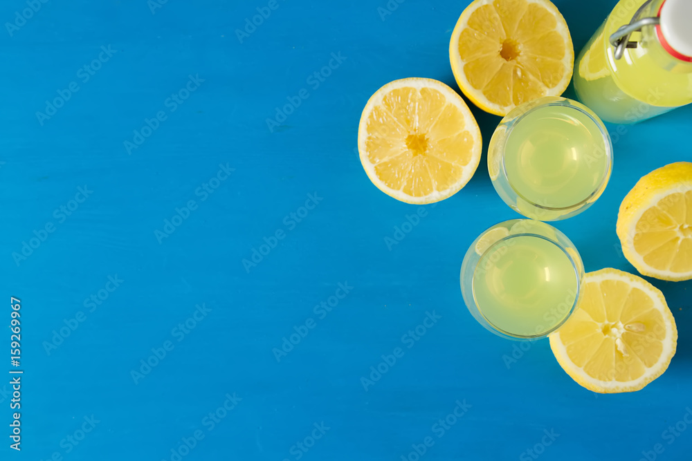 Wall mural traditional italian acoustical leker. lemonchello of lemons. blue background.