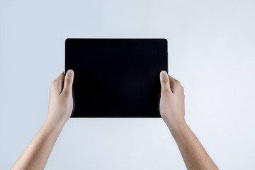 Holding tablet two hands with white background, technology object. include with path file