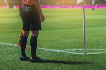 Obraz premium Lineman assistant referee at the corner of a soccer field.