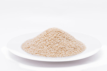 White Sesame Seeds on white plate at on white background
