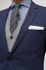 close up of man in a suit with tie and handkerchief