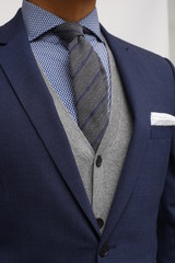 close up of man in a suit with tie and handkerchief