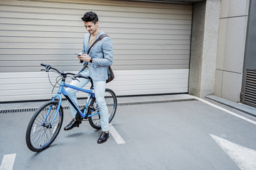 Fototapeta premium Interested busy male person using phone