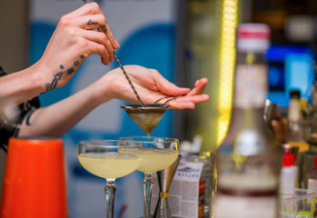 Bartender makes a cocktail