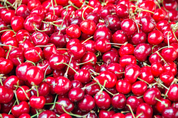 Red cherries background, close up of cherries on a market