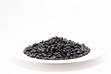 Seed Black bean in white plate on the white background
