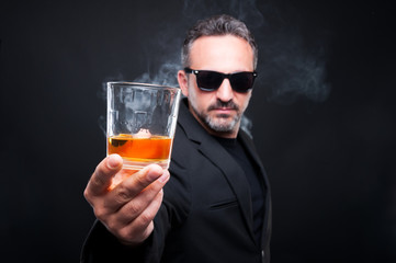 Handsome rich guy inviting you to drink scotch