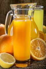 Naklejka na ściany i meble A refreshing orange juice and lemonade with orange, lemon and grapefruit