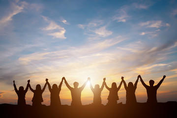 Silhouette of happy business team making high hands in sunset sky background for business teamwork concept - 159281374
