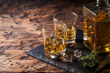 Whiskey with ice in glasses