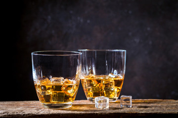 Whiskey with ice in glasses