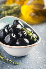 Bowl filled with fresh black olives
