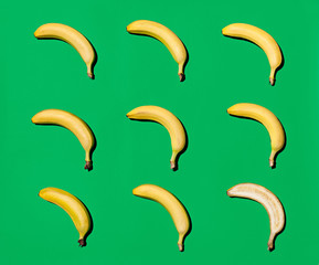 Yellow bananas on green surface