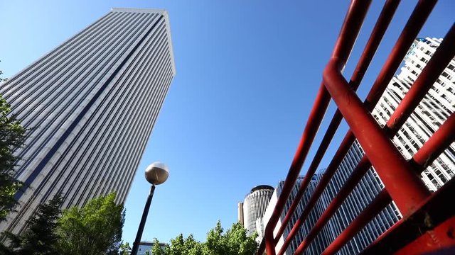 Man jumping over a fence in the city during a parkour session