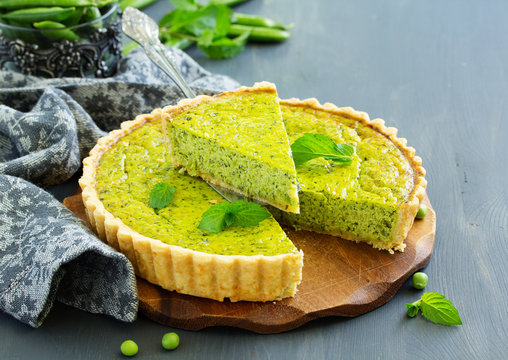 Homemade tart with green peas, bacon and cheese.