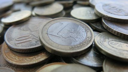 One euro is top of the coins