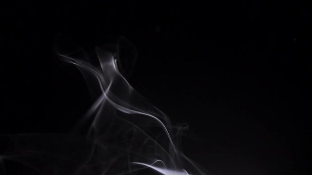 White smoke flowing up. Real steam isolated on black background. 4K UHD video 3840X2160