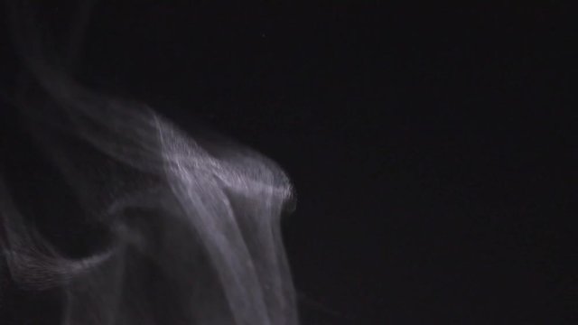 White smoke flowing up. Real steam isolated on black background. 4K UHD video 3840X2160