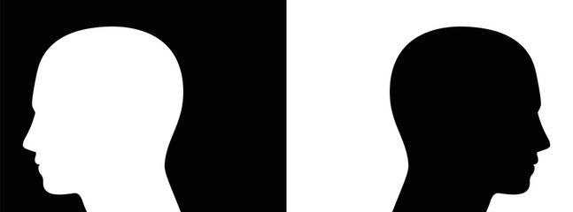 Separation, controversy, opponents - symbolically depicted with two opposed silhouettes of heads on black and white background - also symbol for enmity, polarity, contrast or ignorance.