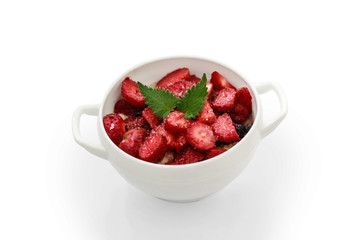 oatmeal with fresh strawberries, mint leaves and berries.