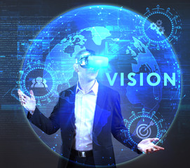 The concept of business, technology, the Internet and the network. A young entrepreneur working on a virtual screen of the future and sees the inscription: Vision