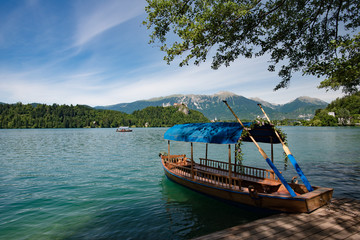 Fototapeta na wymiar Wooden boat on Lake Bled, Slovenia
