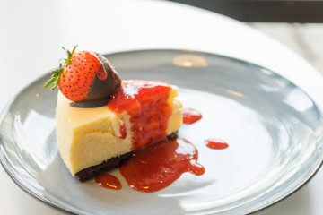 Delicious homemade cheesecake with strawberries (Selective Focus)