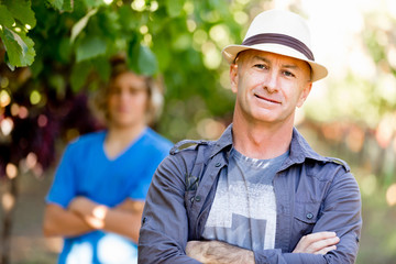 Father and son in vineyard