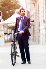 Young businessmen with a bike