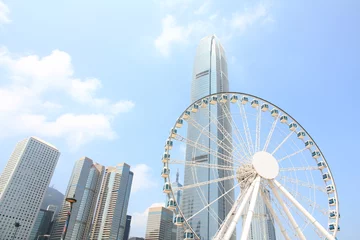 Foto auf Leinwand Ferris Wheel and Skyscrapers in Hong Kong © marcuspon