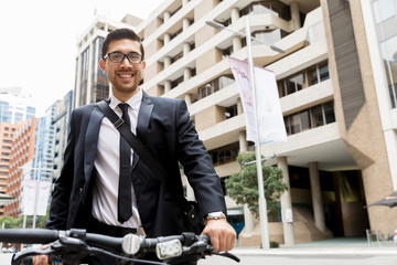 Young businessmen with a bike