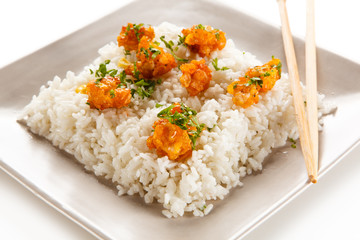 Chicken nuggets with rice on white background