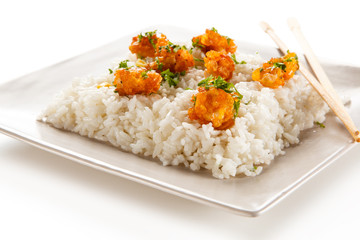 Chicken nuggets with rice on white background
