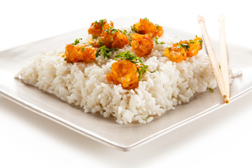 Chicken nuggets with rice on white background