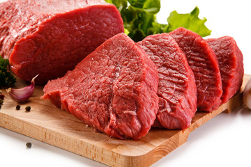 Raw beef on cutting board on white background 