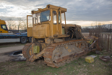 Old abandoned bulldozer. Old rusty and weathered bulldozers