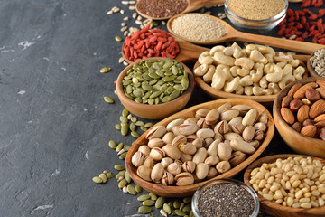 Fototapeta premium Different super foods on a gray background