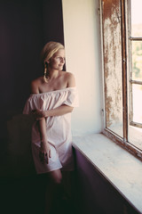 Fototapeta premium Close up portrait of smiling young blonde woman