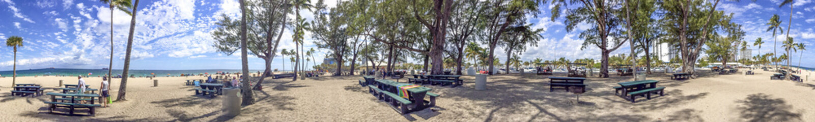 FORT LAUDERDALE, FL - FEBRUARY 2016: Tourists in Fort Lauderdale Beach Park. The city is a major attraction in Florida