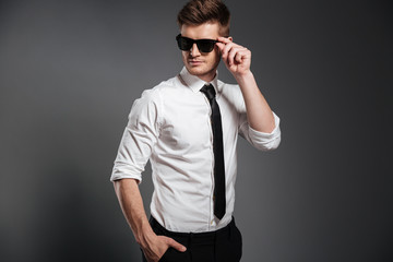 Fototapeta premium Serious young man dressed in formalwear