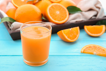 Orange juice with fresh fruit on kitchen table