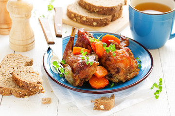 Baked rabbit with vegetables.